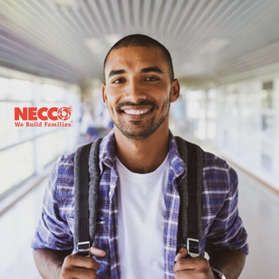 Young Hispanic man holding backpack, with Necco logo