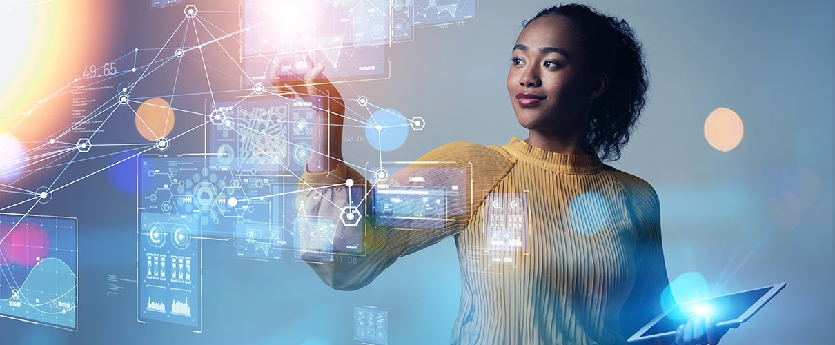 African-American businesswoman surrounded by digital display screens