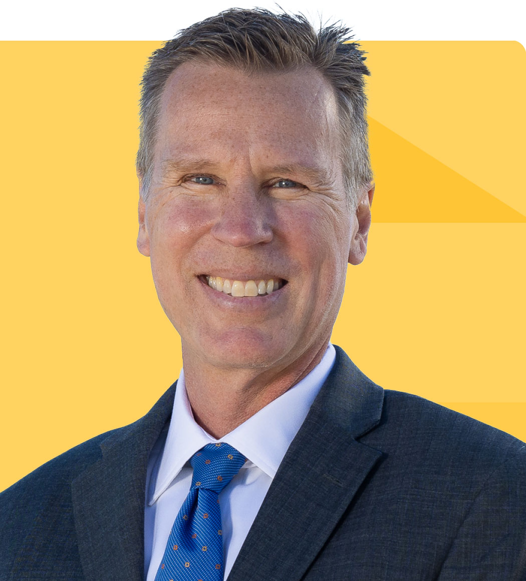 Headshot of David Dannemiller on a gold tessellated background