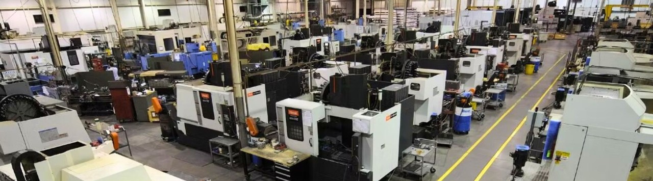 Wide view of manufacturing plant with rows of machines