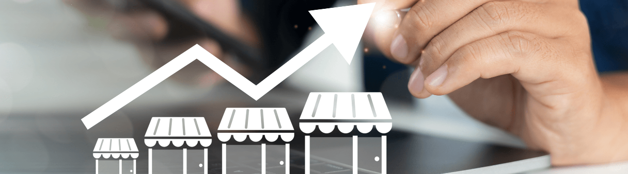 business owner points to a graphic showing business growth