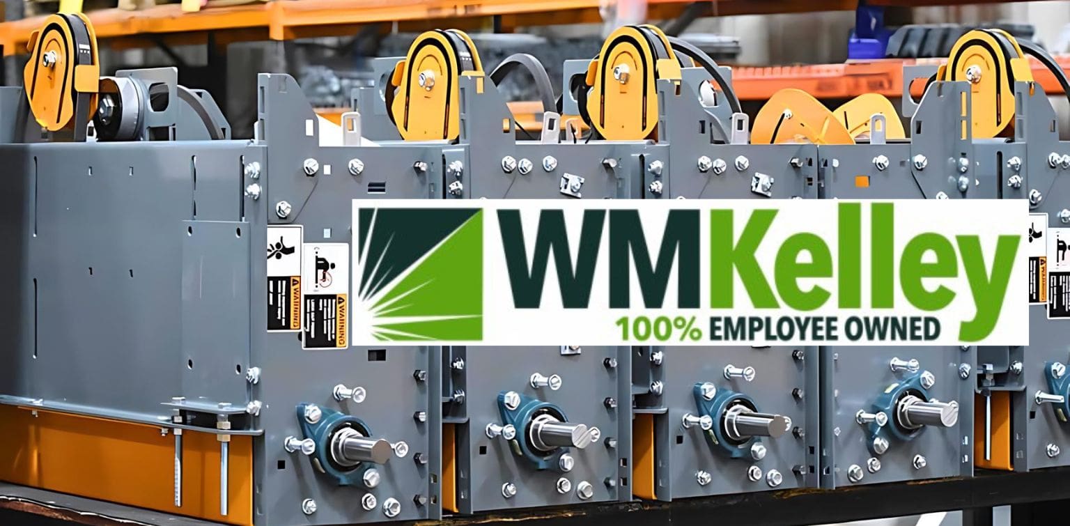 The WM Kelly logo is visible on a sizable machine, highlighting the brand's presence in a manufacturing space.