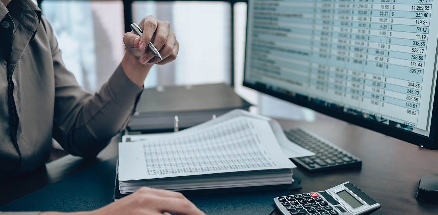 Employee looks over analytics on desktop