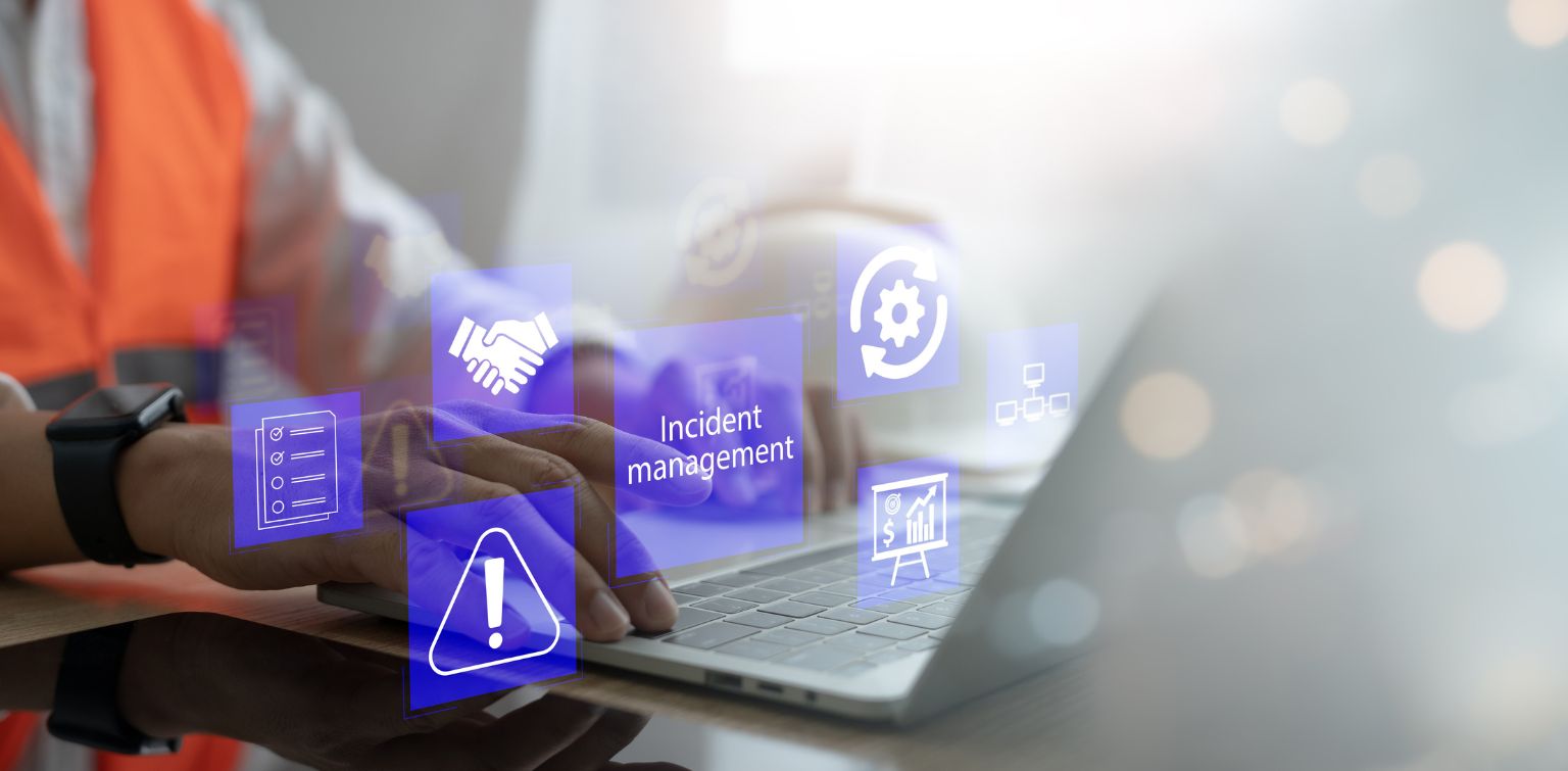 Hands typing on a laptop with symbols that indicate phases of incident response management
