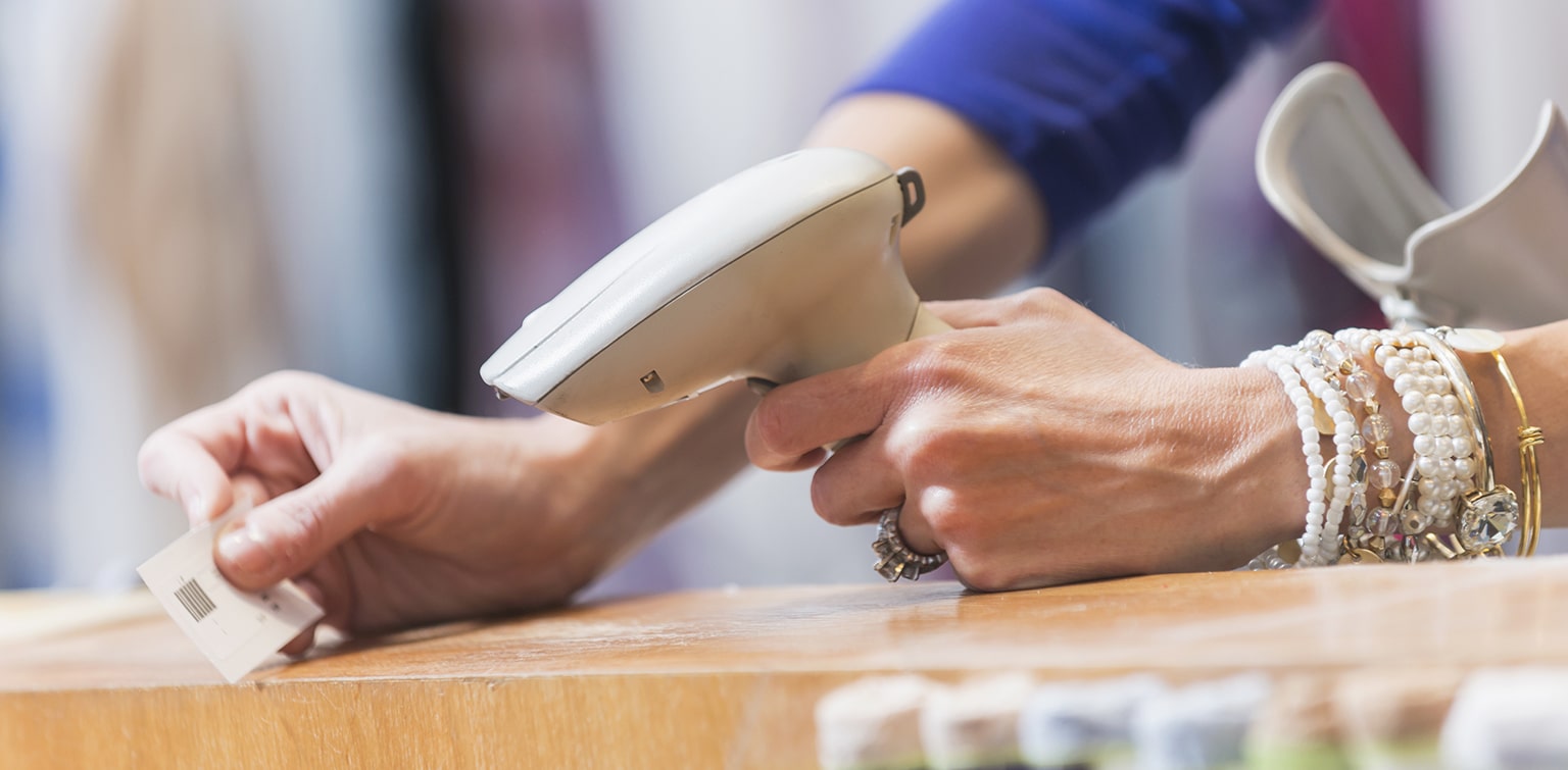 Sales clerk scanning a price tag