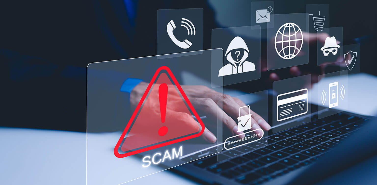 A person typing on a laptop. In the foreground, icons show alerts and potential scams.