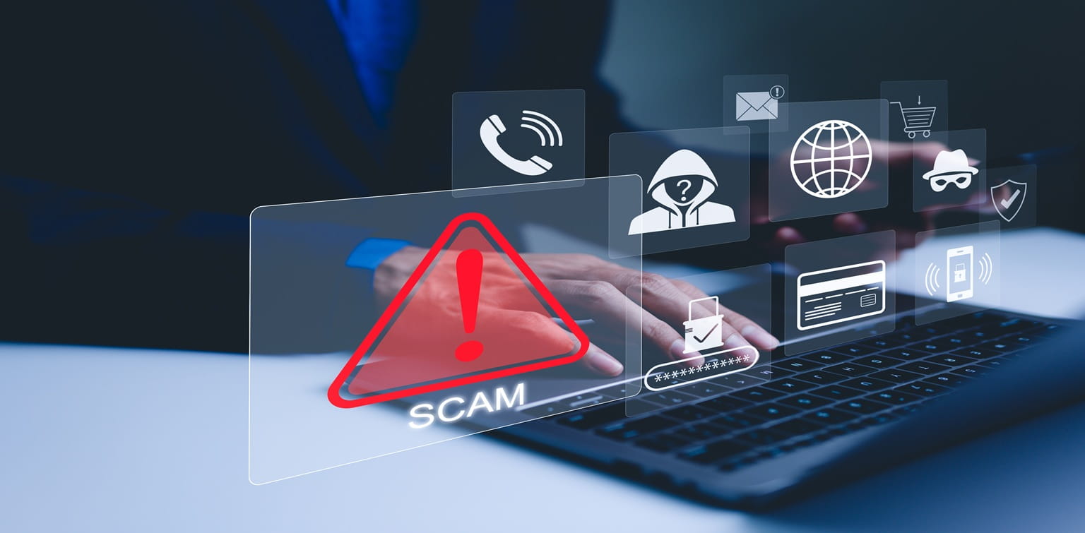 A person is typing on a laptop. In the foreground, icons show alerts and potential scams.