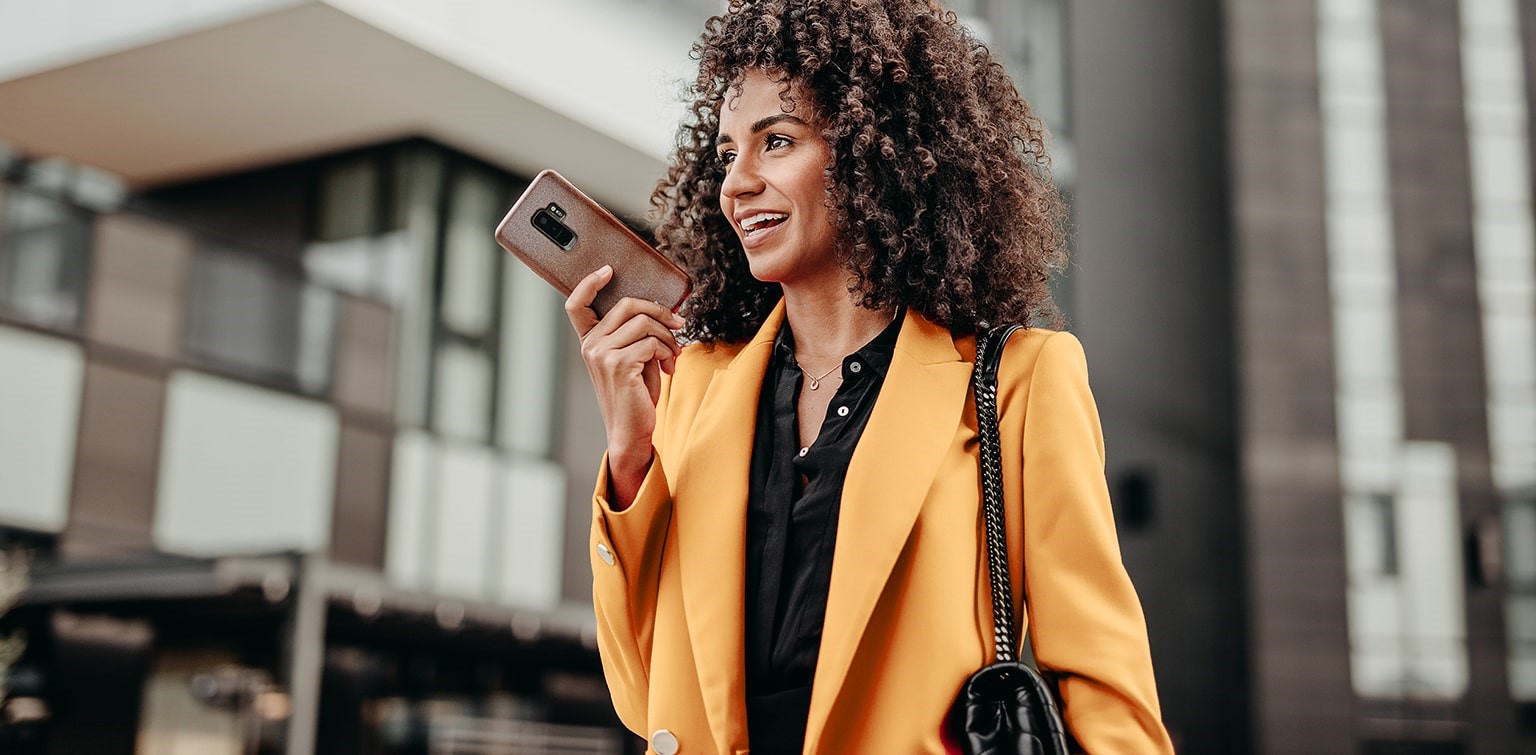 African-American woman speaking on smartphone