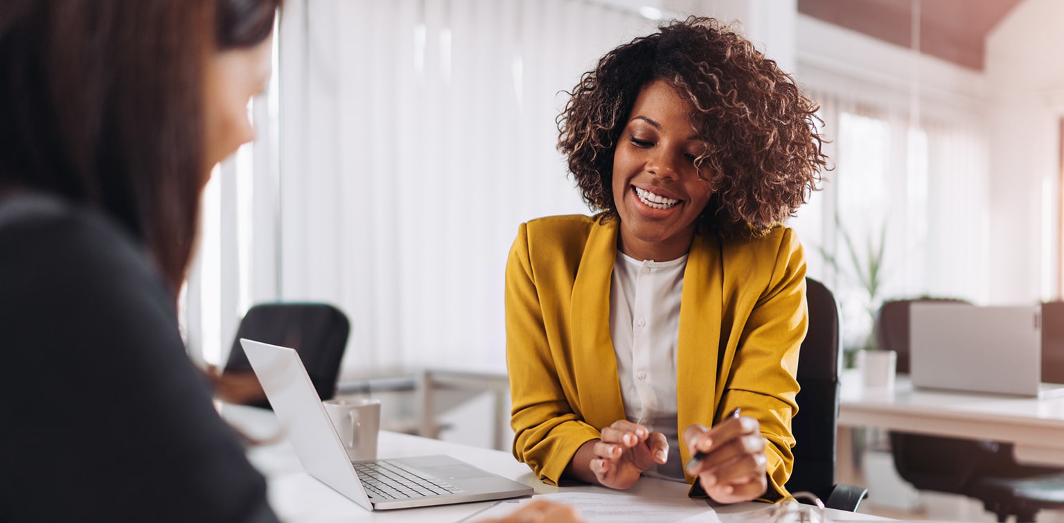 African-American female banker meeting with client