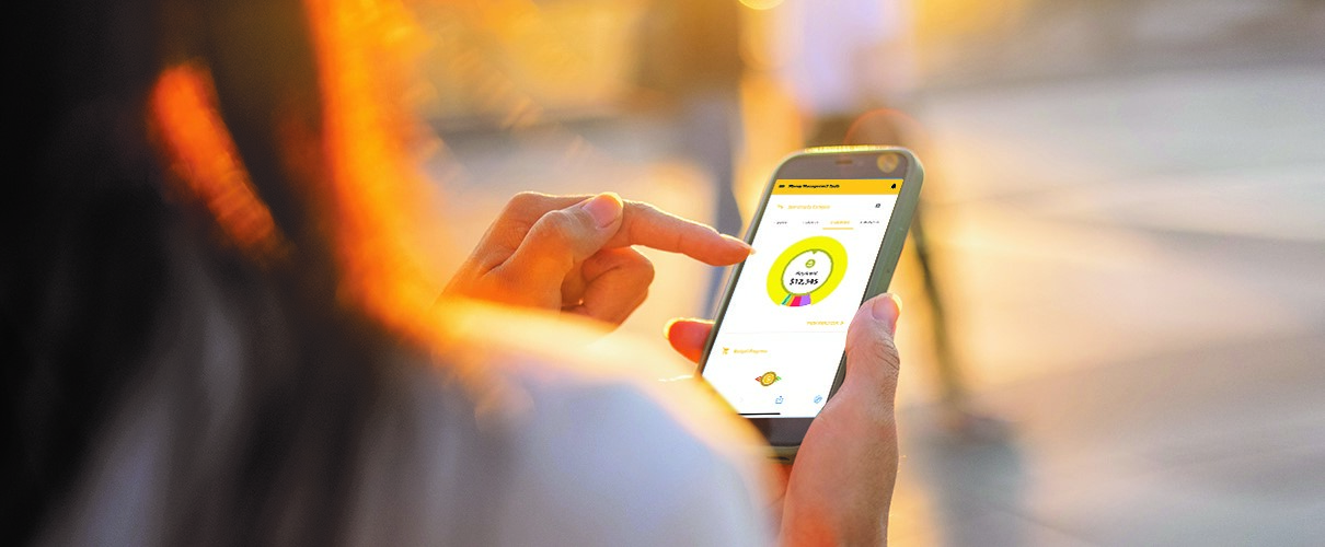 Woman accessing First Financial Bank mobile app on smartphone