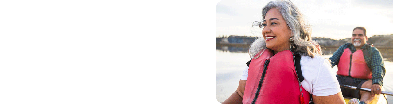 Middle-aged Hispanic couple kayaking