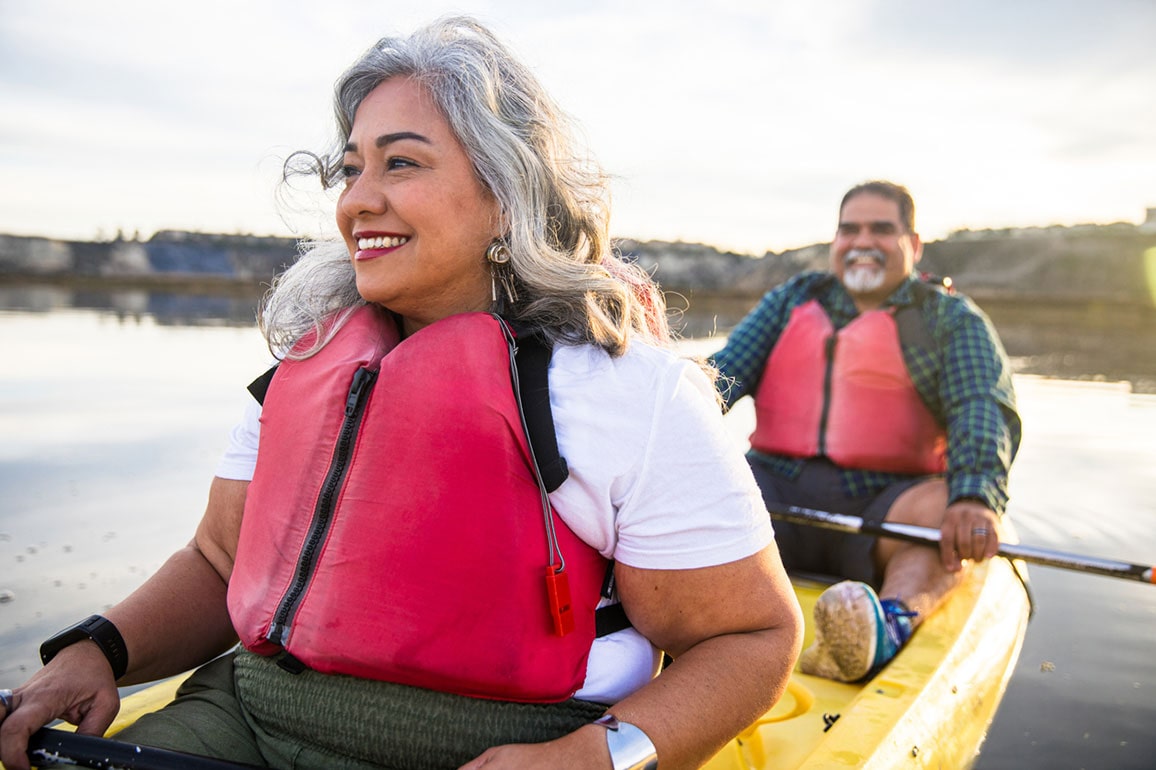 Middle-aged Hispanic couple kayaking