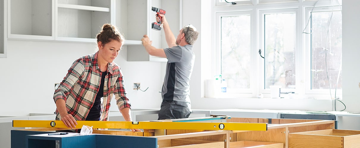 Couple working on kitchen renovation