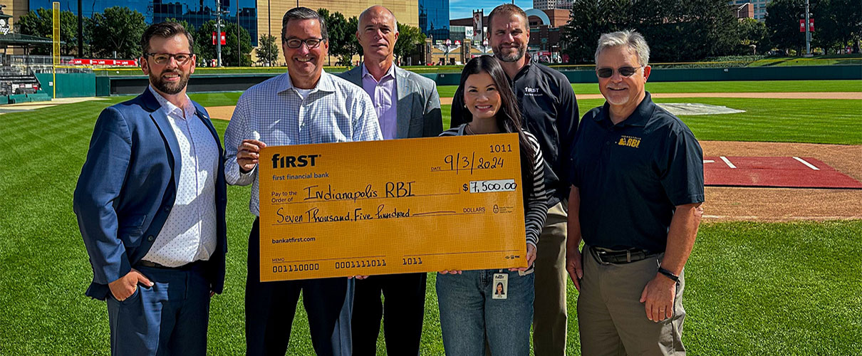 First Financial associates presenting donation check to RBI Indianapolis