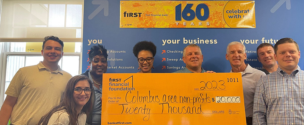 First Financial associates present a donation check to Columbus, OH-area nonprofits
