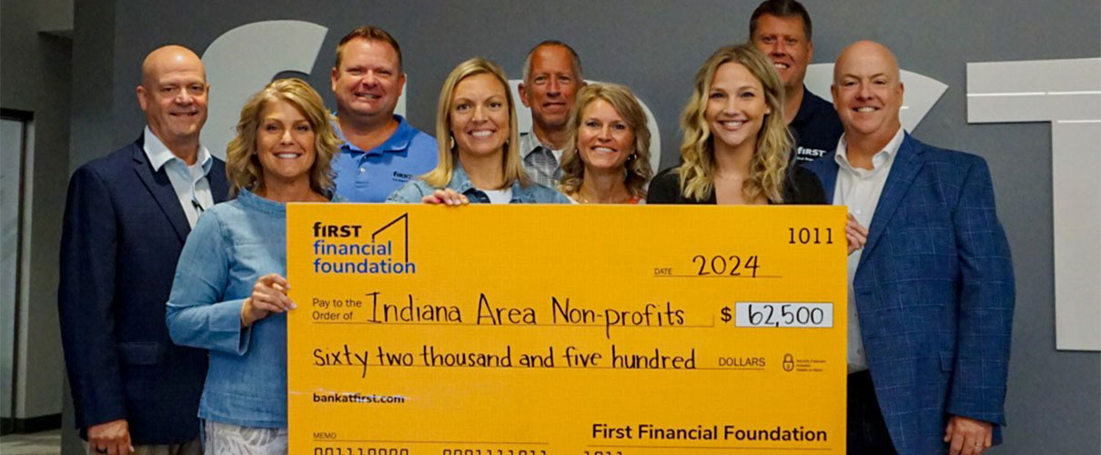 First Financial associates present donation check to Indiana Area nonprofits